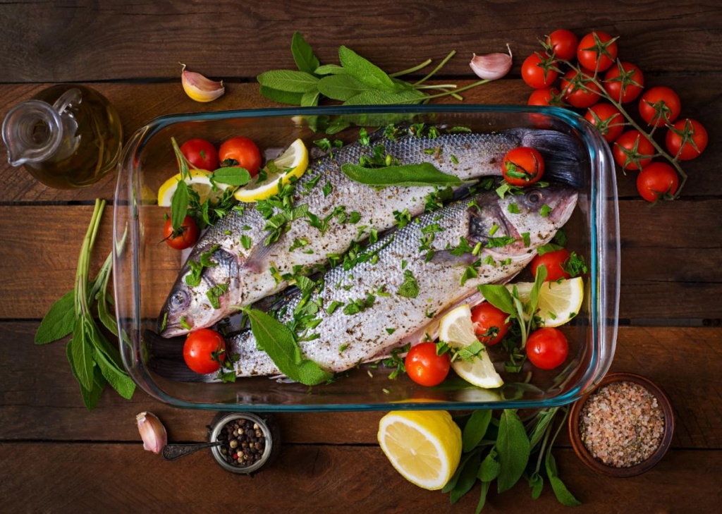 two-raw-seabass-baking-dish-with-spices-old-wooden-table-top-view.jpg